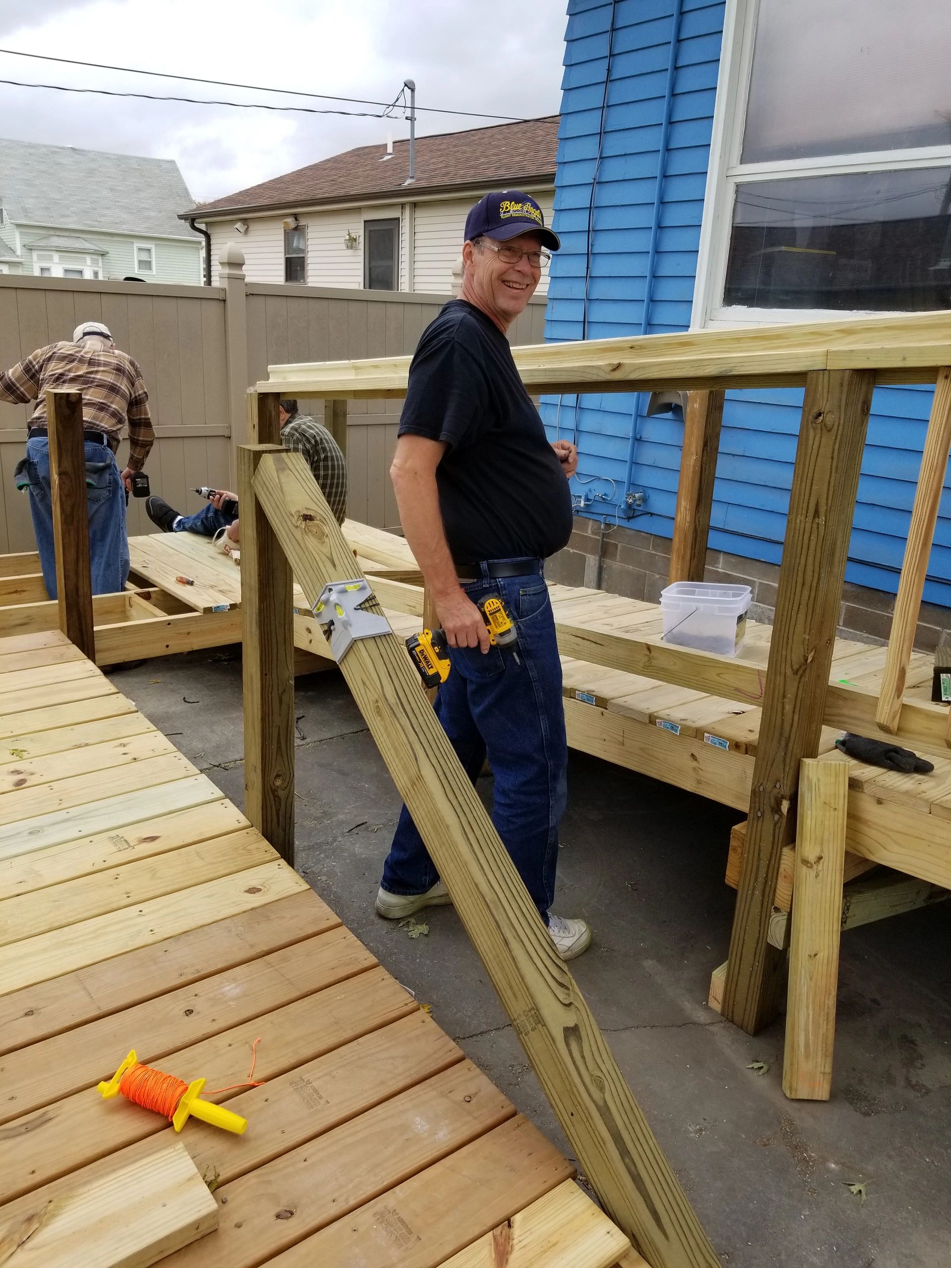 Volunteers building wooden ramp